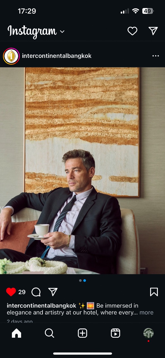Danny Griffin seated in a hotel lounge holding a cup, in an InterContinental Bangkok promotional post.